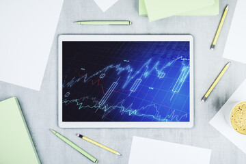 Modern digital tablet monitor with abstract creative financial chart, research and strategy concept. Top view. 3D Rendering