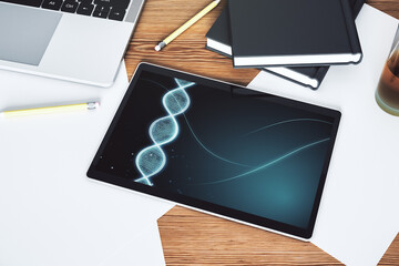 Creative concept with DNA symbol illustration on modern digital tablet screen. Genome research concept. Top view. 3D Rendering