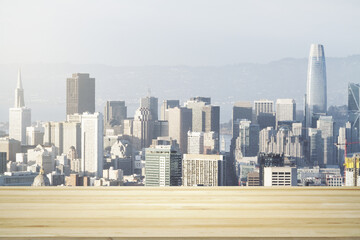 Blank wooden table top with beautiful San Francisco skyline at daytime on background, mockup