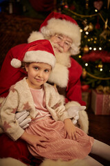 Fototapeta na wymiar smiling girl child with Santa
