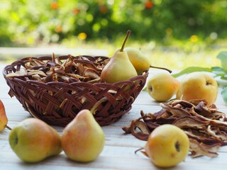 Natural background with dried fruits. Juicy fragrant pears against the backdrop of nature and dried...