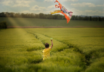 child flying kite
