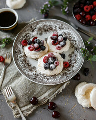 Mini Pavlova meringue with fresh berries and powdered sugar on a vintage plate. Airy crispy dessert.