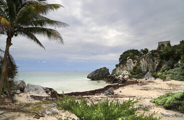 View of the coast and the tower of the Castillo in Tulum, Mexico