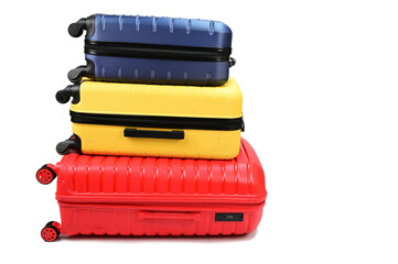 Plastic suitcases of different sizes, lying one on top of the other