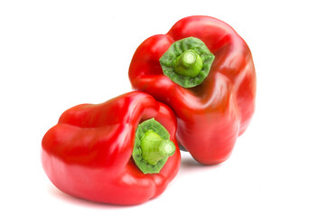 Ripe red sweet bell peppers isolated on white background. Fresh vegetables.