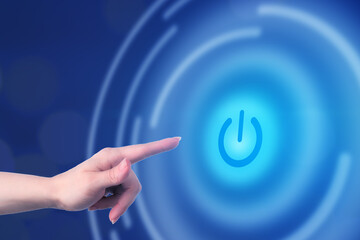 power button icon, hand pushes digital start on touch screen, technology energy concept