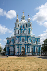 Fototapeta premium a view of the white and blue beautiful facade of the Smolny Cathedral on a clear sunny summer day and a space for copying in Saint-Petersburg
