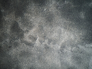 Refined gray textured background. Stains and streaks are present. Dark and light areas. Fine grain.