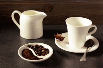 Empty cup of coffee and beans on table background texture. Break coffee time
