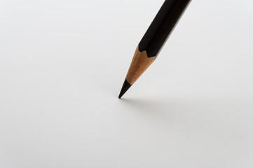 Black Pencil on a Light Background.