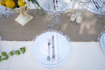 detail of place at the table on a laid table in the garden