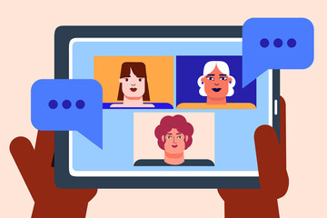 Two brown hands holding a tablet, device. A group of three people, colleagues, women, friends chatting with each other. Connecting with technology, speech bubbles