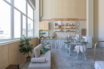 simple cozy home interior of an open plan ordinary room with a kitchen and bedroom area