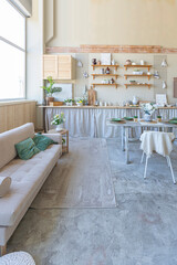 simple cozy home interior of an open plan ordinary room with a kitchen and bedroom area