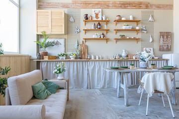 simple cozy home interior of an open plan ordinary room with a kitchen and bedroom area
