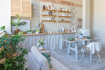 simple cozy home interior of an open plan ordinary room with a kitchen and bedroom area