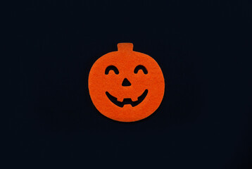 Black Halloween background with  scary pumpkin