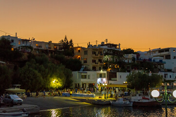 Fototapeta na wymiar party in greek port village by nightfall