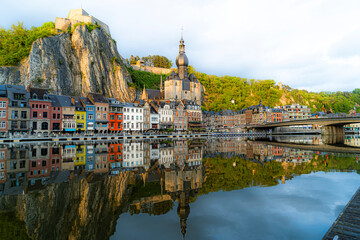 Toeristic pictures of the city Dinant togheter with the River Meuse or Maas.  Beautifull clouds, sunsets or blue hours with reflections on the water.  Belgium Ardennes toeristic topshots.