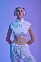 Attractive futuristic woman in modern headphones