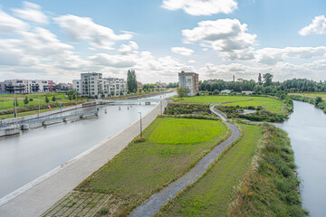 Toeristic pictures of the city Harelbeke, city close to Courtrai or Kortrijk.  Long Shuttertime picture with the Canal Leie.  Marketplace and river pictures of high quality.  Blue sky in flanders