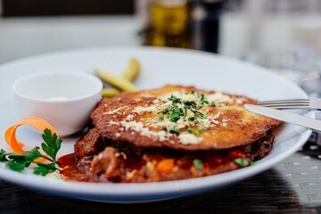 Dinner dish at the restaurant. Crispy potato pancakes and Hungarian goulash.
