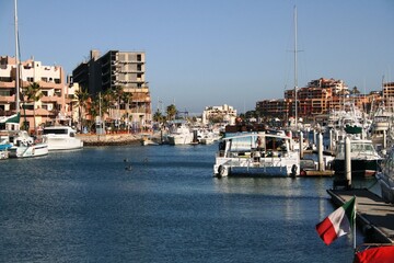 Traditional image of a marina dock for small boats and yachts in Cabo San Lucas on a sunny day