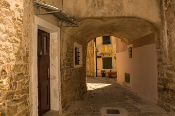 An arched street in the historic medieval village of Buje in Istria, Croatia

