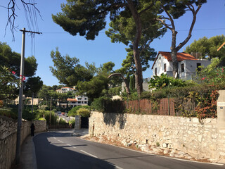 Fototapeta na wymiar Seafront houses and villas in Cassis, located in the Provence-Alpes-Côte d'Azur region, on the French Riviera in Southern France. 