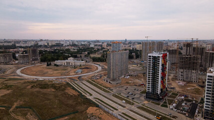 Obraz premium Construction site for a new city block. Construction work is underway. The constructed buildings are visible. Aerial photography.