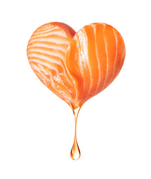 A drop of oil dripping from salmon fillet in the shape of a heart