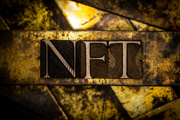 NFT text on vintage textured copper and gold background