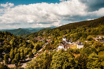 Church in The Spania Dolina village with mining landscape, Slovakia, Europe.