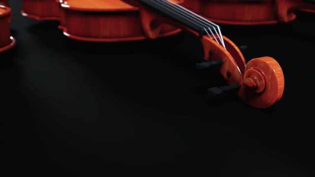 Violins in row isolated on black background - Video in Ultra HD 4K and 24 FPS with big black areas for copy.