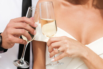 A loving couple holds glasses of champagne. Romantic portrait of a happy couple in love.