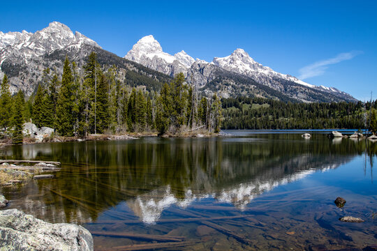 Reflection of the Grand Tetons in Taggart Lake, Jackson Hole, Wyoming © mtatman