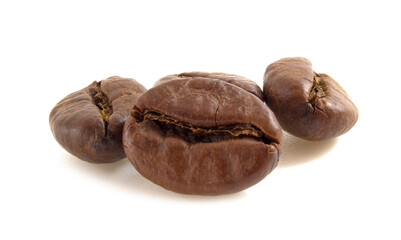 Arabica coffee beans close up isolated on white background.