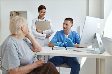 Obraz na płótnie Canvas elderly woman at doctor's and nurse's appointments diagnostics service