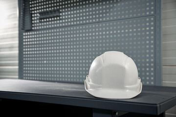 Working white safety helmet in production