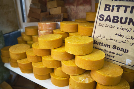 Natural traditional turkish bittim soap. Craft soap bars at traditional store counter. Pyramid of handmade soap with natural additives and extracts. 