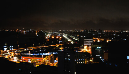 Fototapeta na wymiar Panorama of Porto Alegre city's entrance in the evening, and and the lights across the cityscape, southern Brazil.
