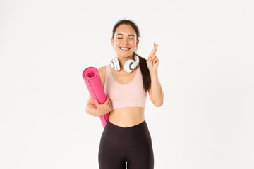 Sport, wellbeing and active lifestyle concept. Hopeful cute asian girl dreaming of going to gym...