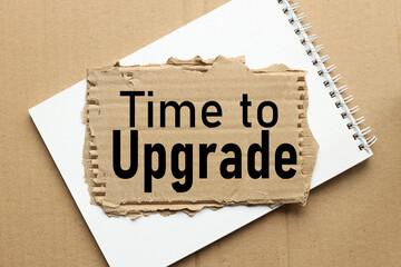 time to upgrade. text on torn cardboard. torn paper on side pad