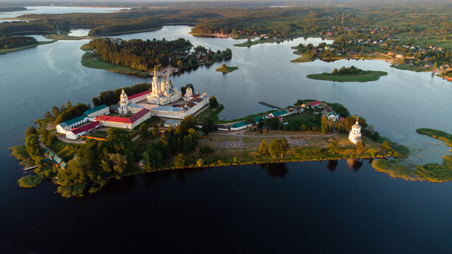 Sunset over Nilova Pustyn - an ancient Russian monastery, was founded in 1594 on the island of Stolobny. The first color photo was taken by Sergei Proskudin-Gorsky in 1910.