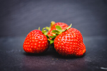 Strawberries on black background