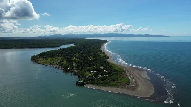 Zancudo peninsula Costa Rica aerial shot black sand beach paradise sunny day Golfe Dulce