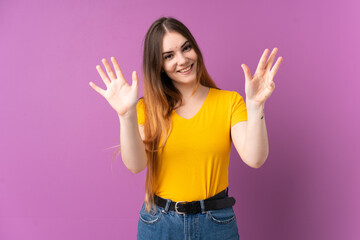 Young caucasian woman isolated on purple background counting nine with fingers