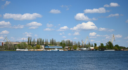 Obraz premium view of the river port with landing stage and cranes on a summer day. Kherson Ukraine
