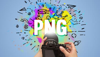 Close-up of a hand holding digital camera with abstract drawing